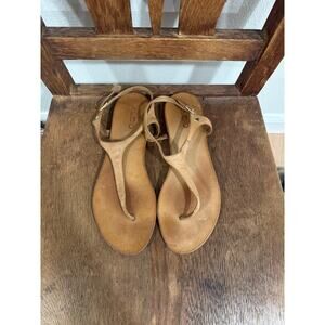 Also brown leather flip flops